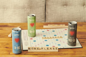 Greenbar highball canned cocktails on scrabble board